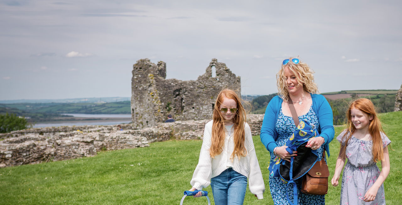 Adult and two children walking in Carmarthenshire