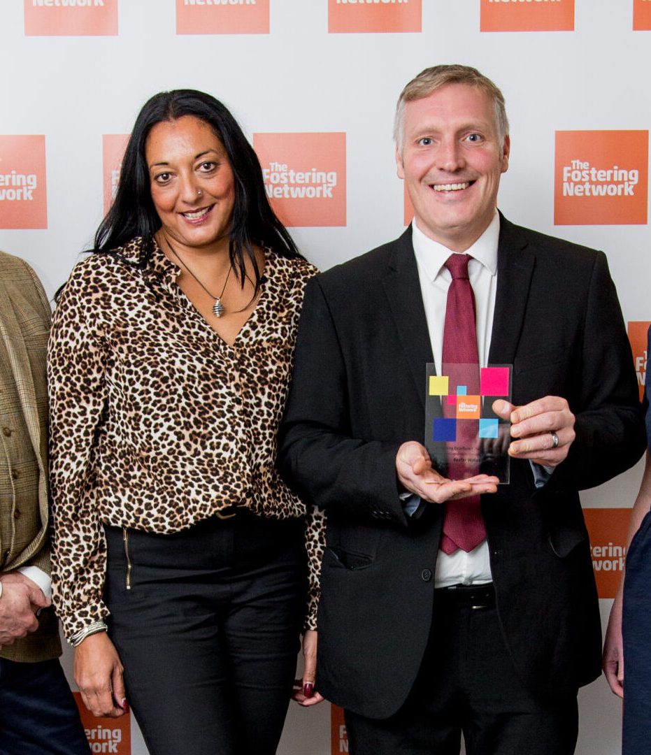 Group of four receiving award