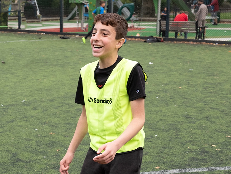 young refugee football player