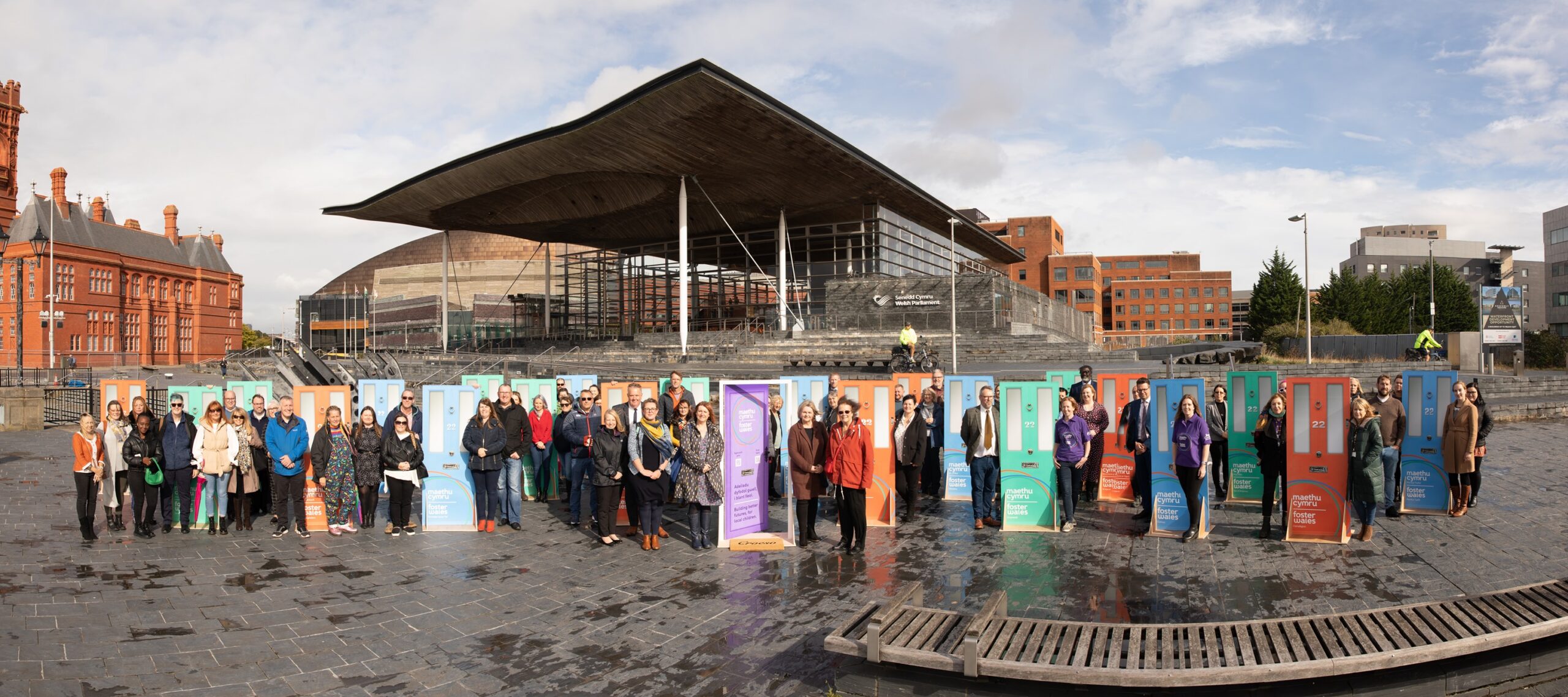 Launch of foster wales outside Senedd in July 2021 with 22 doors
